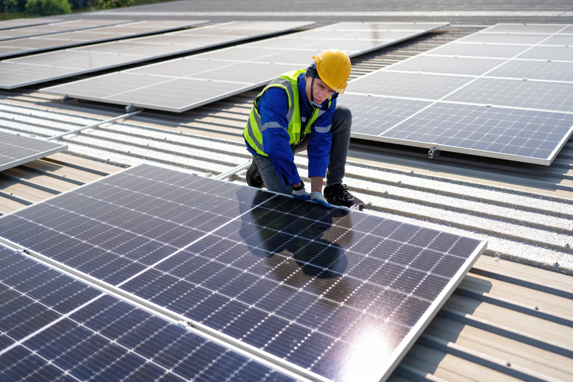 Engineer On Rooftop Kneeling Next To Solar Panels 2024 10 14 20 28 16 Utc